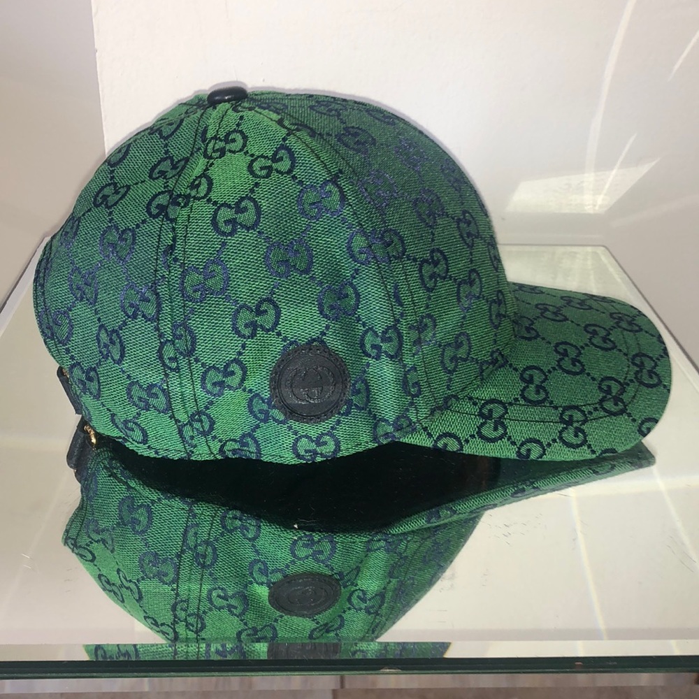 Green and navy colored adjustable baseball cap leather adjustable band